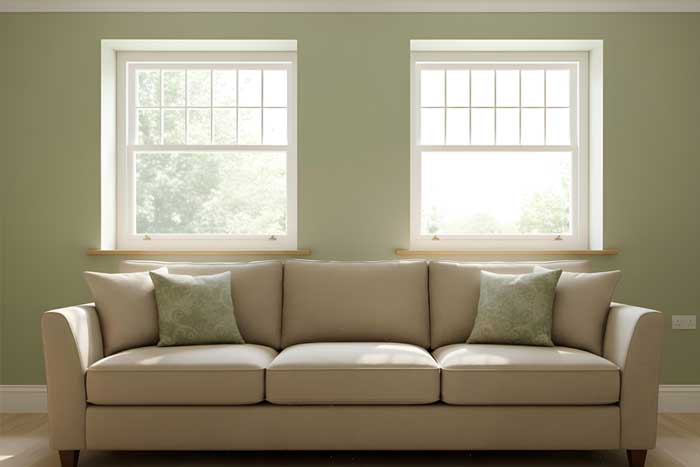 Home exterior featuring a white-framed window with red curtains next to a wooden entry door, showcasing clean siding, updated design, and professional Window Replacement Atlanta services for improved style and energy efficiency.